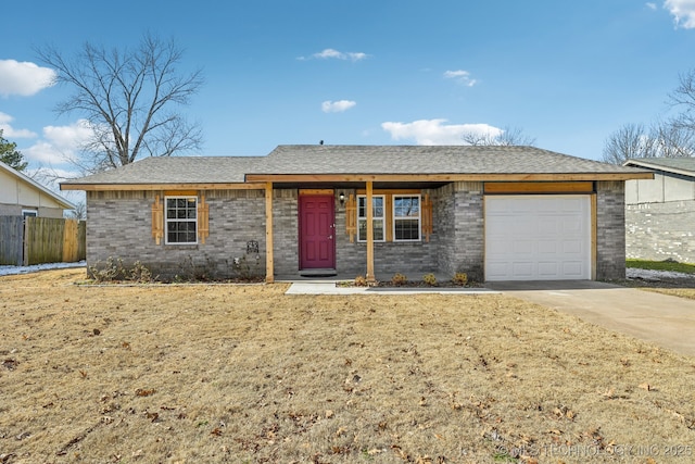 ranch-style house featuring a garage and a front lawn