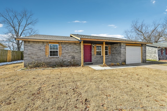 single story home with a front yard and a garage