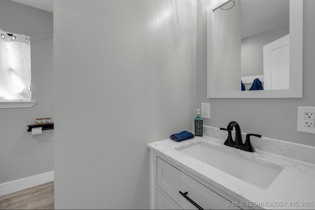 bathroom with wood-type flooring and vanity