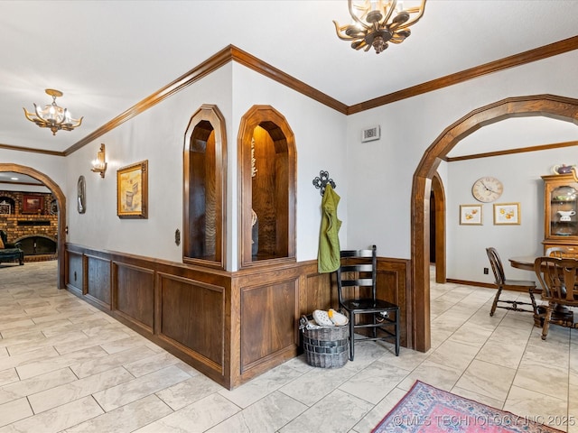 interior space featuring a notable chandelier and a fireplace