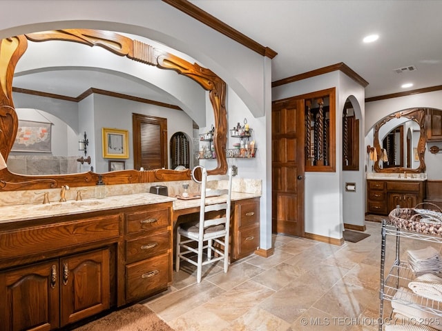 bathroom featuring vanity and crown molding