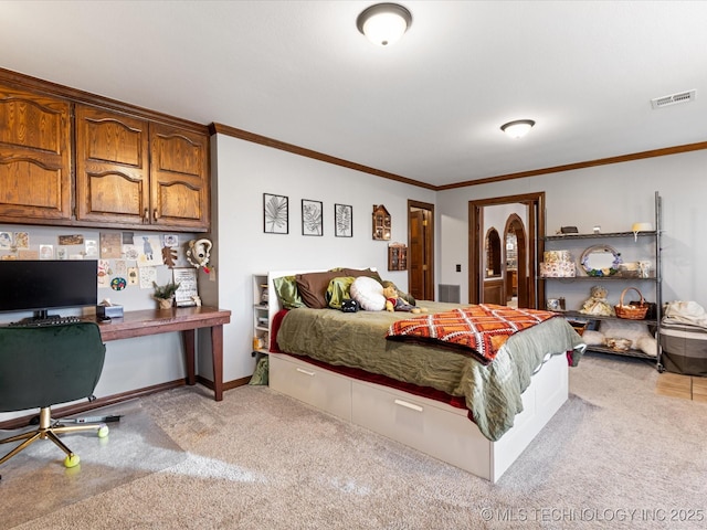 carpeted bedroom featuring crown molding