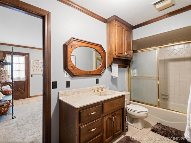 full bathroom with vanity, combined bath / shower with glass door, crown molding, toilet, and tile patterned floors