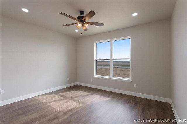 unfurnished room with hardwood / wood-style floors and ceiling fan