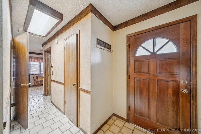 entryway with a textured ceiling