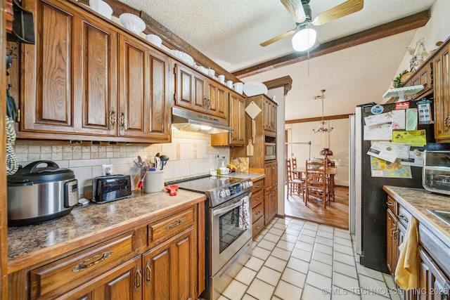 kitchen with appliances with stainless steel finishes, tasteful backsplash, a textured ceiling, ceiling fan with notable chandelier, and light tile patterned floors