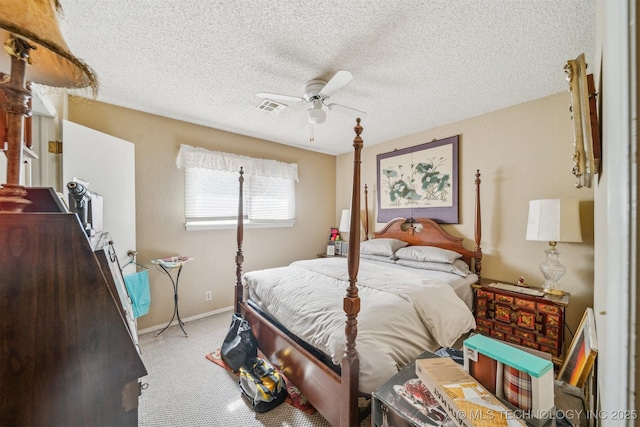 bedroom with carpet, a textured ceiling, and ceiling fan