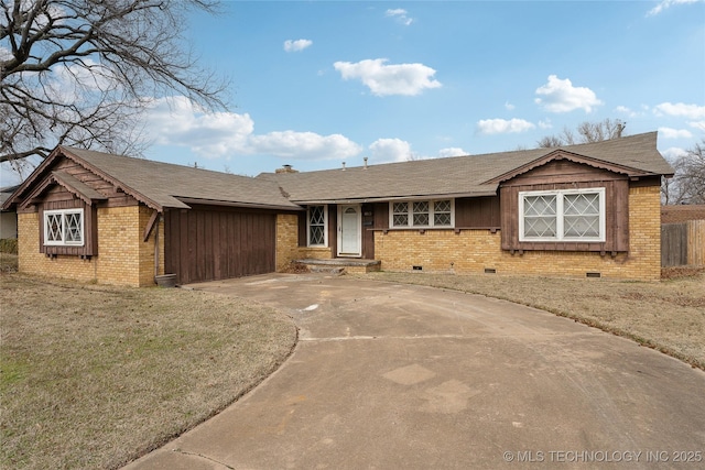 single story home with a front yard and a garage