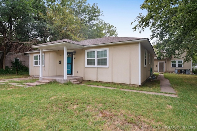 bungalow-style home featuring a front yard