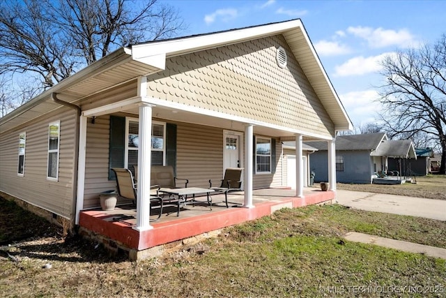 rear view of house with a porch