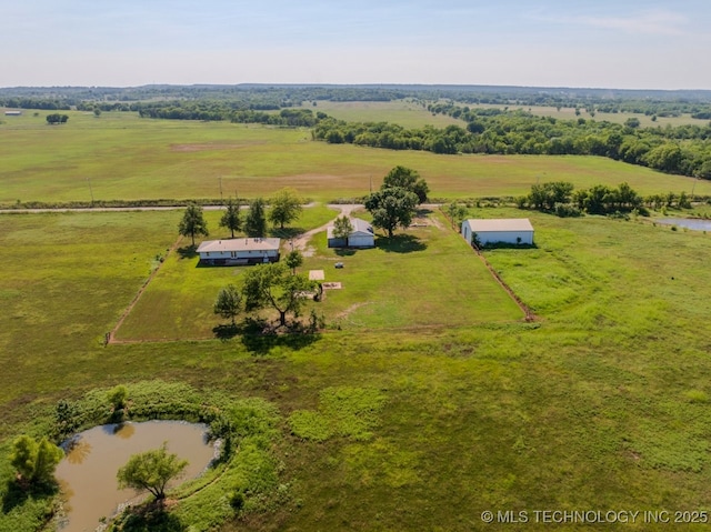 drone / aerial view with a water view and a rural view