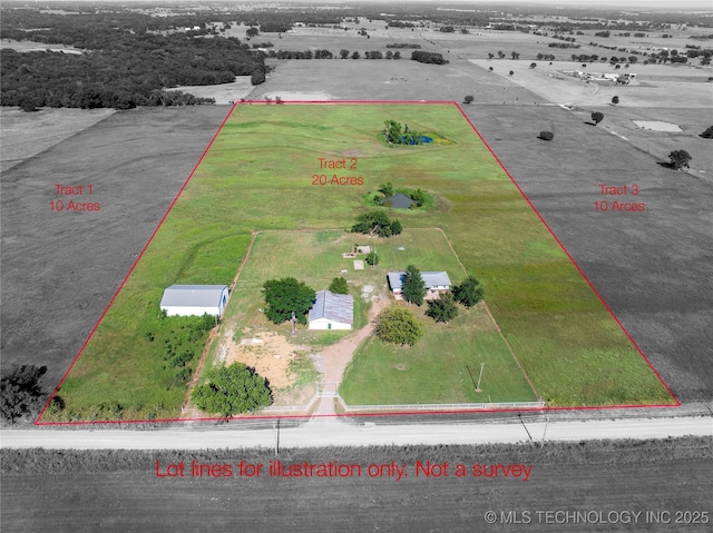 birds eye view of property with a rural view