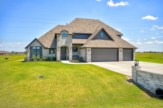 french country inspired facade featuring a front lawn, concrete driveway, and roof with shingles