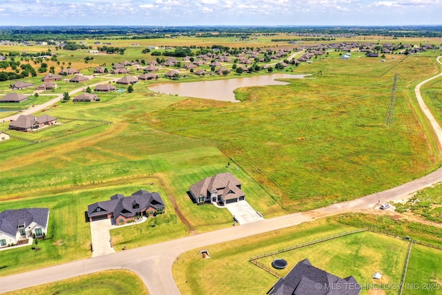 aerial view with a water view and a residential view