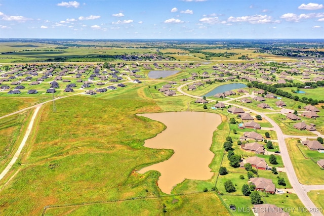 birds eye view of property featuring a water view and a residential view