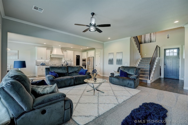 living area featuring stairs, recessed lighting, visible vents, and crown molding