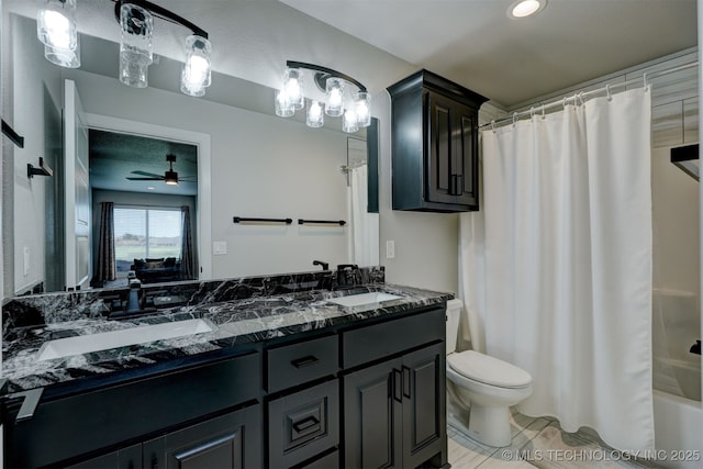 bathroom with shower / tub combo, a sink, toilet, and double vanity