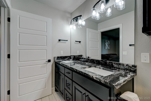 full bath featuring a sink and double vanity