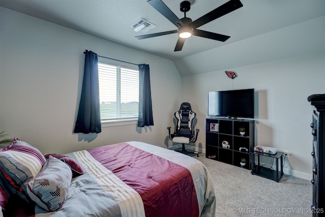 bedroom featuring visible vents, carpet flooring, vaulted ceiling, ceiling fan, and baseboards