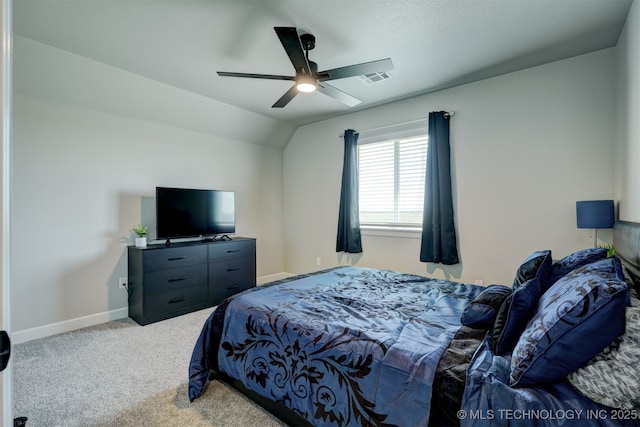 bedroom featuring visible vents, a ceiling fan, light carpet, vaulted ceiling, and baseboards