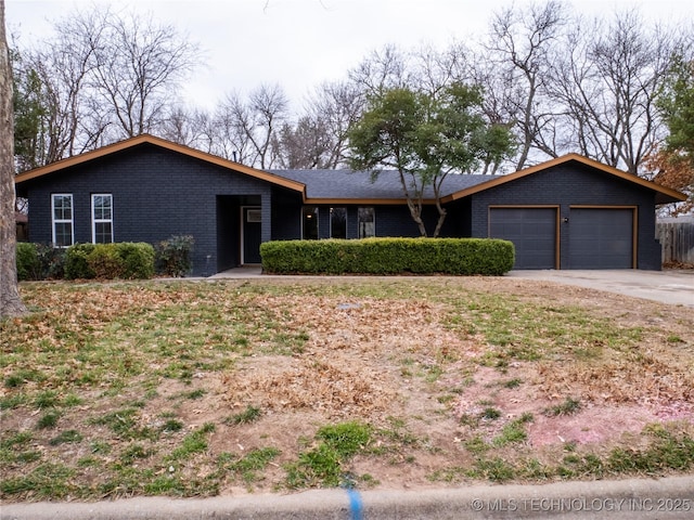 ranch-style home featuring a garage