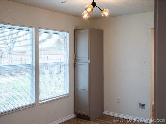 4008 NW Meadowbrook, Lawton, OK 73505 - interior space featuring hardwood / wood-style floors and a notable chandelier