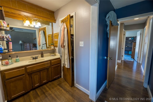 bathroom with hardwood / wood-style floors and vanity