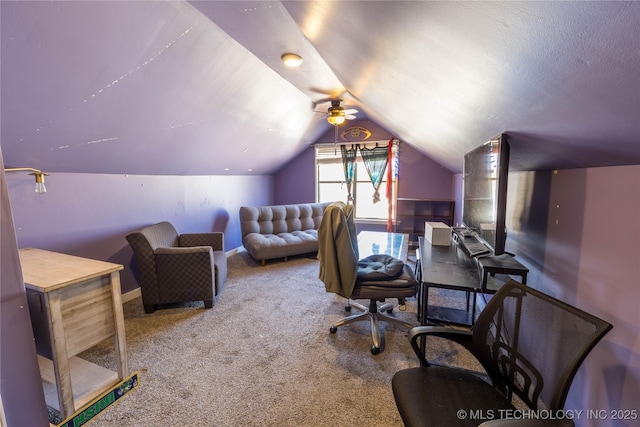 carpeted office space with lofted ceiling