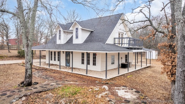 rear view of house with central AC