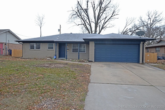 single story home featuring driveway, an attached garage, and brick siding