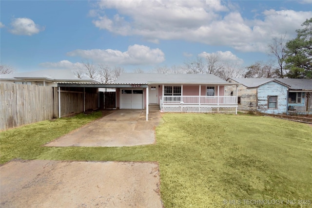 view of front facade with covered porch, a garage, fence, concrete driveway, and a front lawn