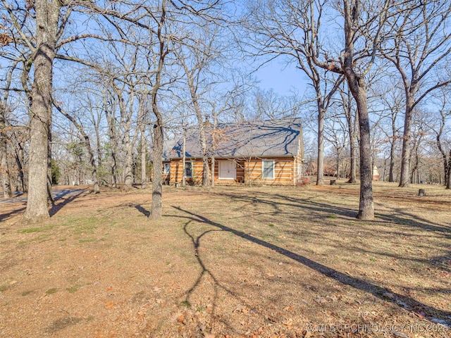 log home with a front yard