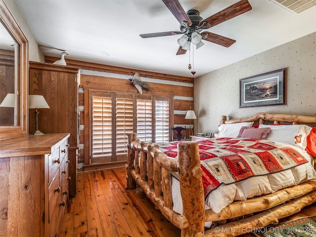 bedroom featuring hardwood / wood-style floors and ceiling fan