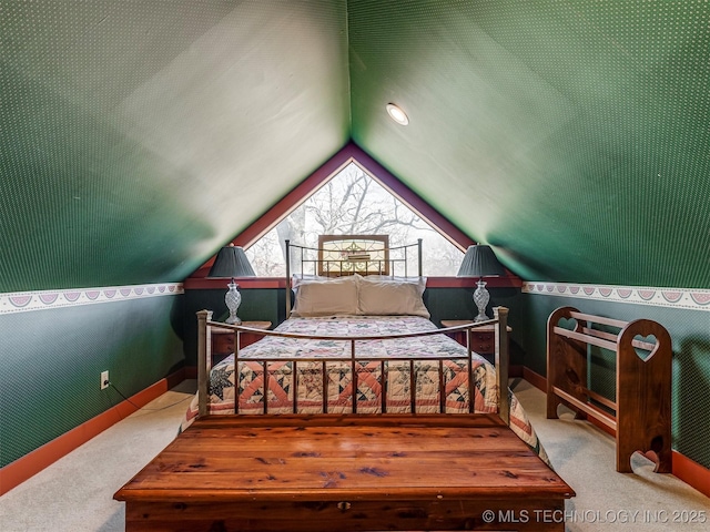 carpeted bedroom featuring lofted ceiling