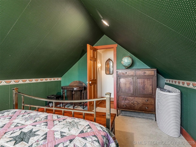 carpeted bedroom with vaulted ceiling