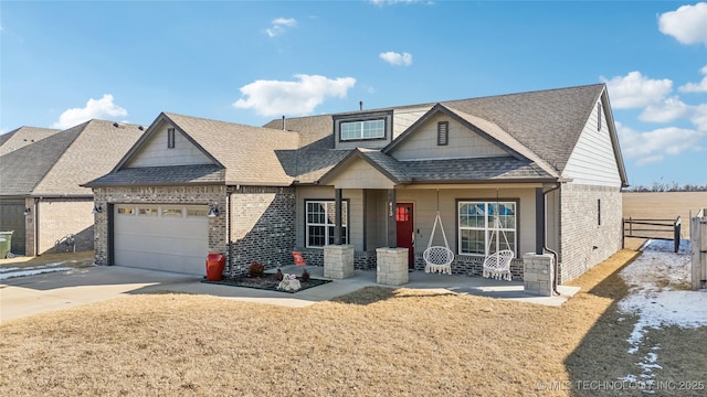 craftsman-style house with covered porch and a garage