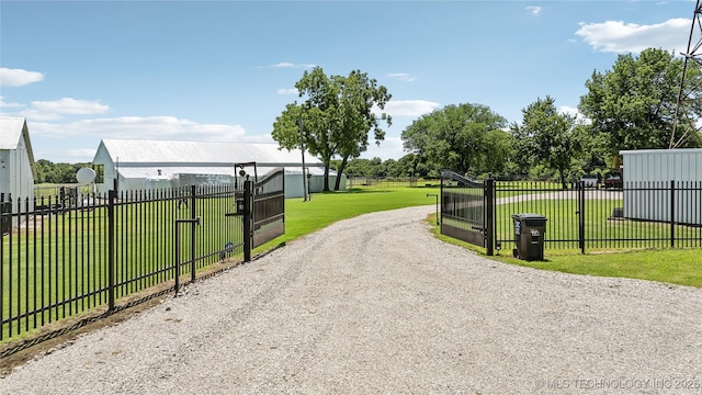 view of gate featuring a yard