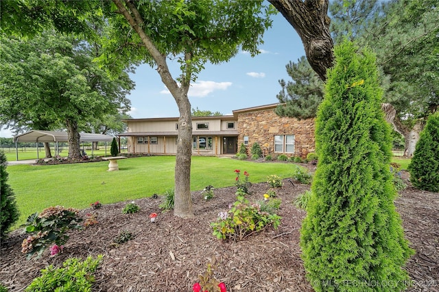 view of yard with a carport