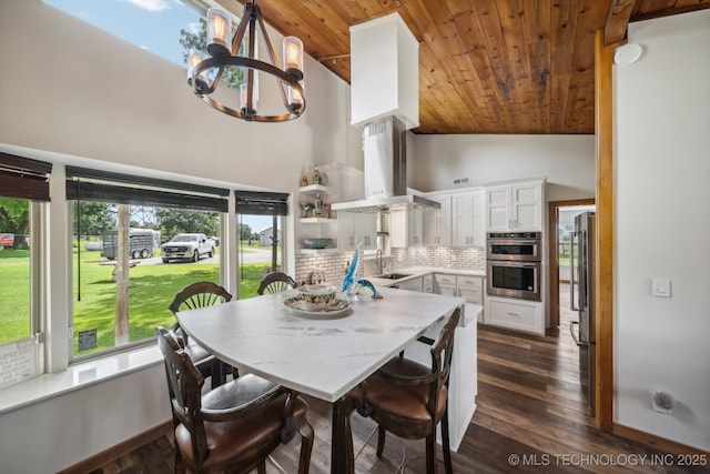 42900 W 11th St, Terlton, OK 74081 - dining area featuring wood ceiling, a chandelier, high vaulted ceiling, and dark wood finished floors