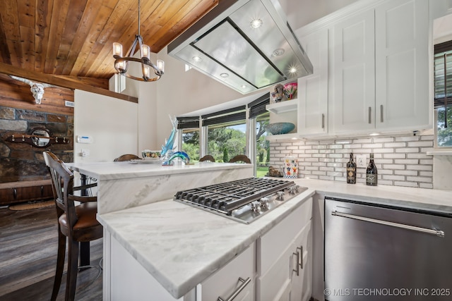 42900 W 11th St, Terlton, OK 74081 - kitchen featuring appliances with stainless steel finishes, wooden ceiling, white cabinets, backsplash, and a peninsula