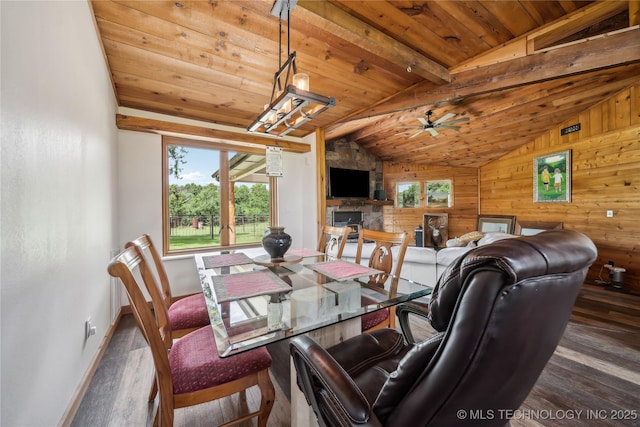 dining room with wooden ceiling, vaulted ceiling with beams, and dark hardwood / wood-style floors