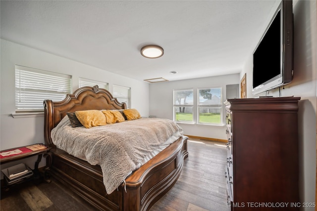 bedroom featuring hardwood / wood-style flooring