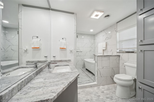 full bathroom with tile walls, vanity, toilet, and separate shower and tub