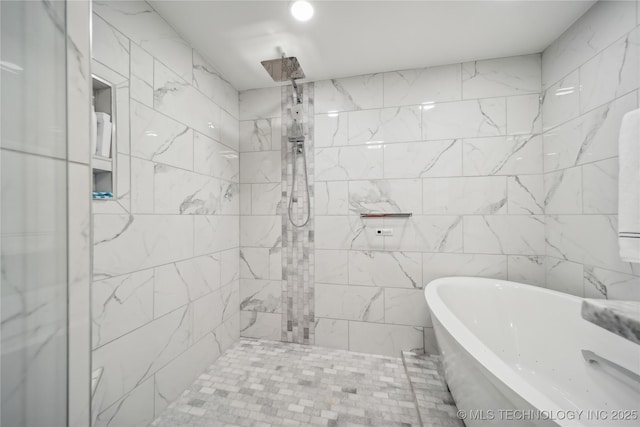 bathroom featuring separate shower and tub and tile walls