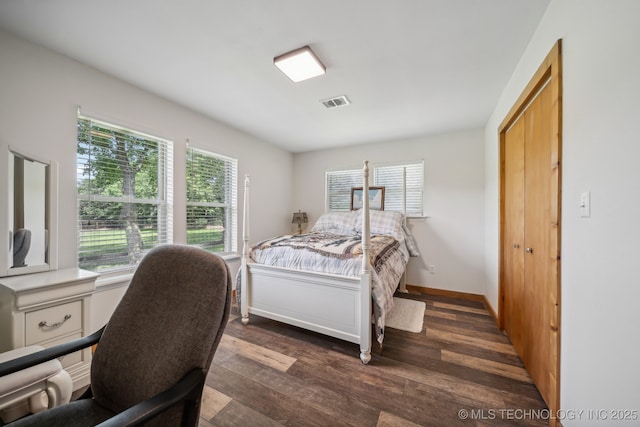 42900 W 11th St, Terlton, OK 74081 - bedroom with multiple windows, dark wood finished floors, and baseboards
