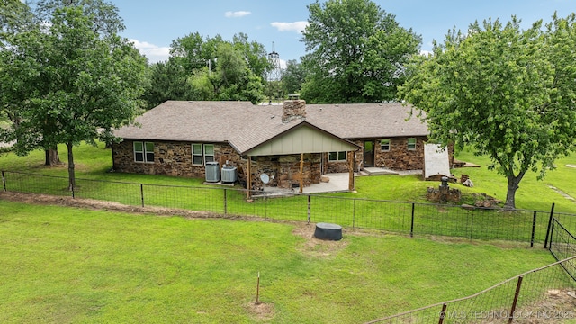 42900 W 11th St, Terlton, OK 74081 - view of front of home featuring stone siding, a chimney, a patio area, roof with shingles, and central AC