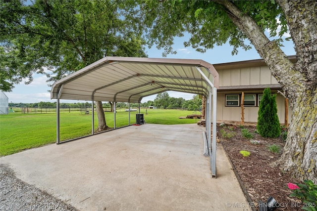 view of car parking featuring a yard and a carport