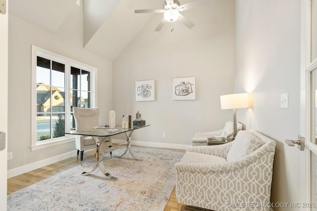 office space featuring light wood-type flooring, vaulted ceiling, and ceiling fan