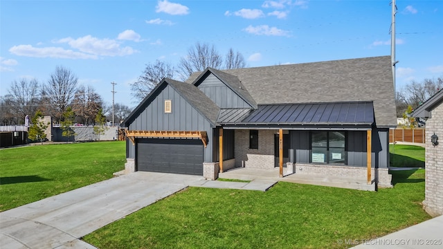 view of front facade with brick siding, a shingled roof, driveway, a front lawn, and a standing seam roof