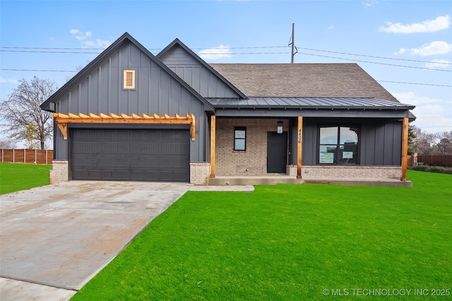 modern farmhouse featuring concrete driveway, brick siding, and a standing seam roof